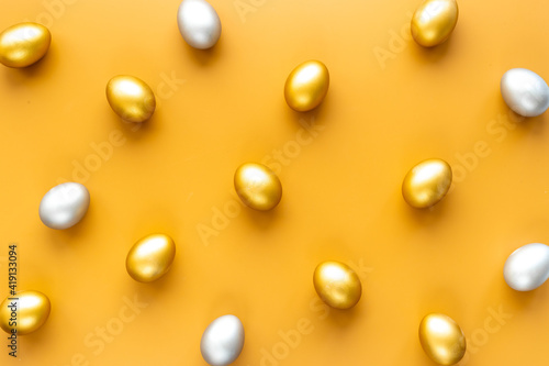 Silver and golden Easter eggs. Easter decoration, top view