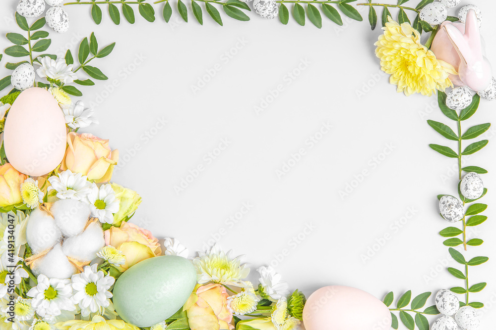 Creative layout composition of flowers and easter eggs on pastel background. Creative layout composition of flowers and easter eggs on pastel background.