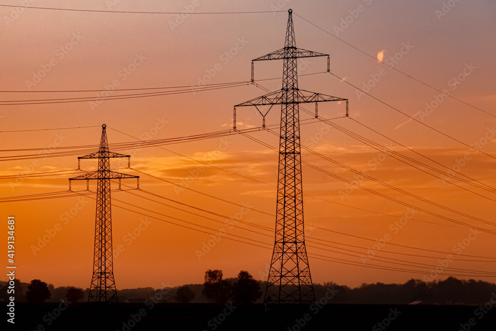Fototapeta premium Beautiful sunset with overland high voltage lines near Tabertshausen, Bavaria, Germany