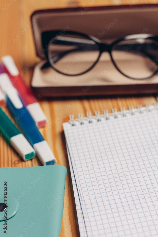 notepads felt-tip pens stationery glasses in a case work desk notepads felt-tip pens stationery glasses in a case work desk
