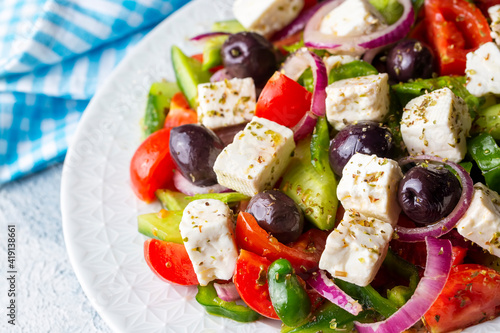 Greek salad with fresh vegetables, feta cheese and kalamata olives. Healthy food.