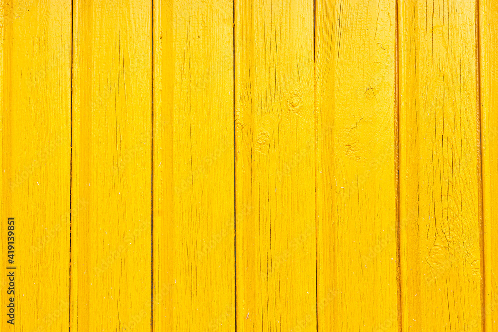 Obraz premium background of wooden boards painted with yellow paint