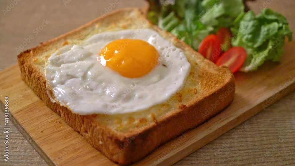 homemade bread toasted with cheese and fried egg on top with vegetable salad for breakfast homemade bread toasted with cheese and fried egg on top with vegetable salad for breakfast