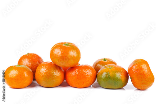 Pile of ripe juicy orane (clemetine ) isolated on a white background
