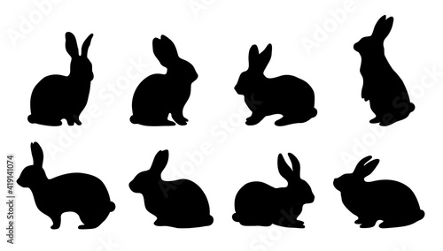 Set of Easter bunny silhouettes looking up, standing and sitting. Outline rabbits shadow in profile. Vector illustration isolated on white background collection