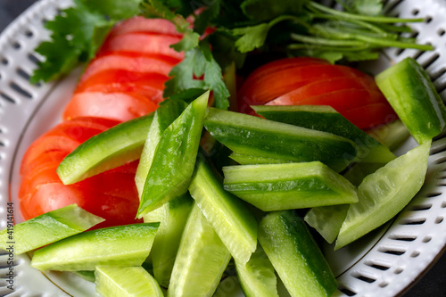 Sliced cucumber, tomato and...