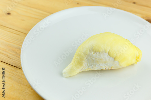 Single Durian on white plate, King of fruit of Thailand.