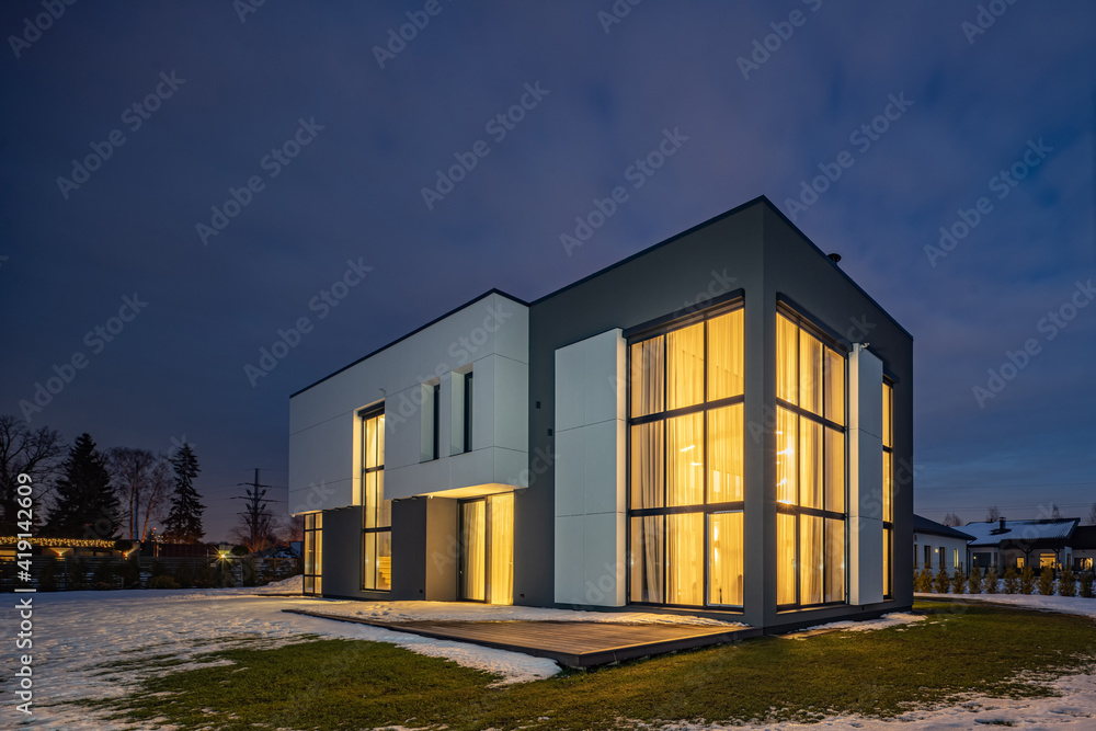 Exterior of luxury private house. Modern cottage at evening.