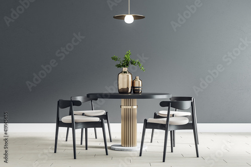 Fototapeta Black round table with wooden chairs around in the center of modern dining room