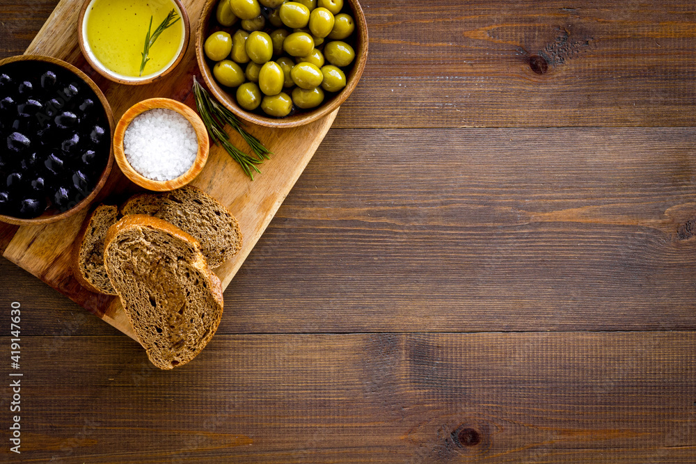 Italian food background with olives oil and sliced bread. Top view Italian food background with olives oil and sliced bread. Top view