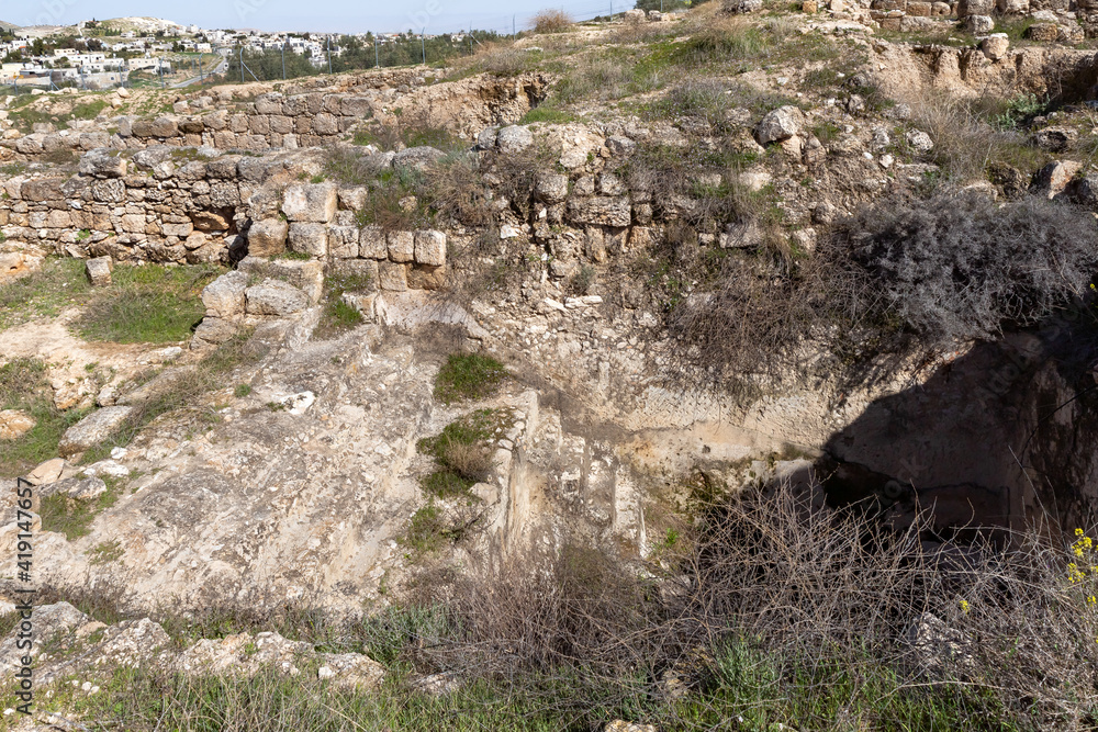 Well-preserved  remains of the steps to the ritual Jewish bath for bathing - mikveh, in the ruins of the outer part of the palace of King Herod,in the Judean Desert, in Israel