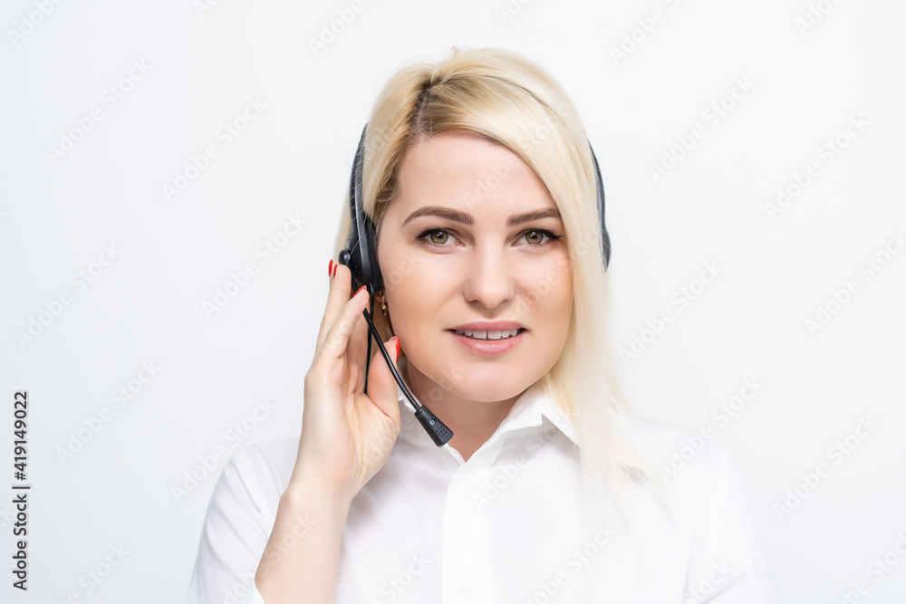 Portrait of cheerful customer support female phone operator in headset, against white wall background. Consulting and assistance service call center. Portrait of cheerful customer support female phone operator in headset, against white wall background. Consulting and assistance service call center.