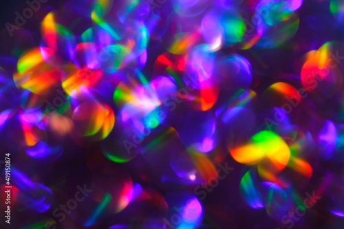Abstract Bright Colorful Rainbow Blurred Bokeh Background. Unfocused Colored Texture of Glitter.