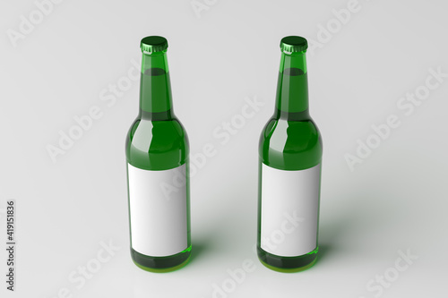 Two beer bottles 500ml mock up with blank label on white background.