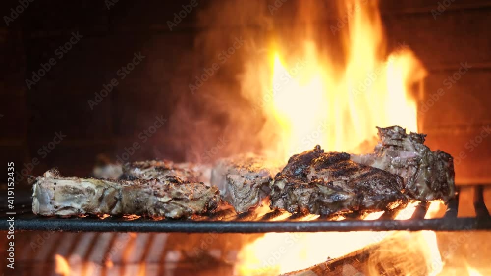 A top sirloin steak flame broiled on a barbecue, shallow depth of field A top sirloin steak flame broiled on a barbecue, shallow depth of field
