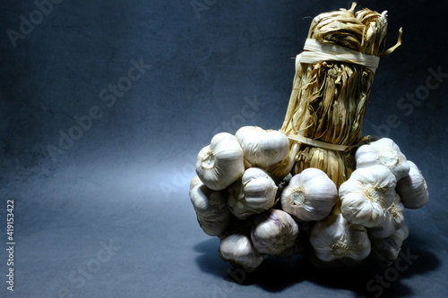 Fresh garlic from the farm on the kitchen floor.