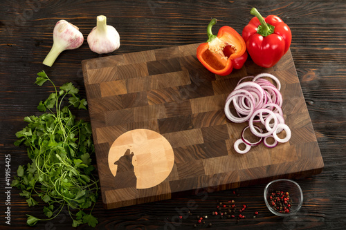 Fresh vegetables, herbs and spices on a cutting board