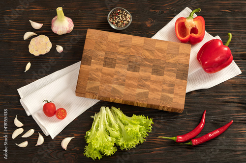 Obraz na płótnie Fresh vegetables, herbs and spices on a cutting board w salonie