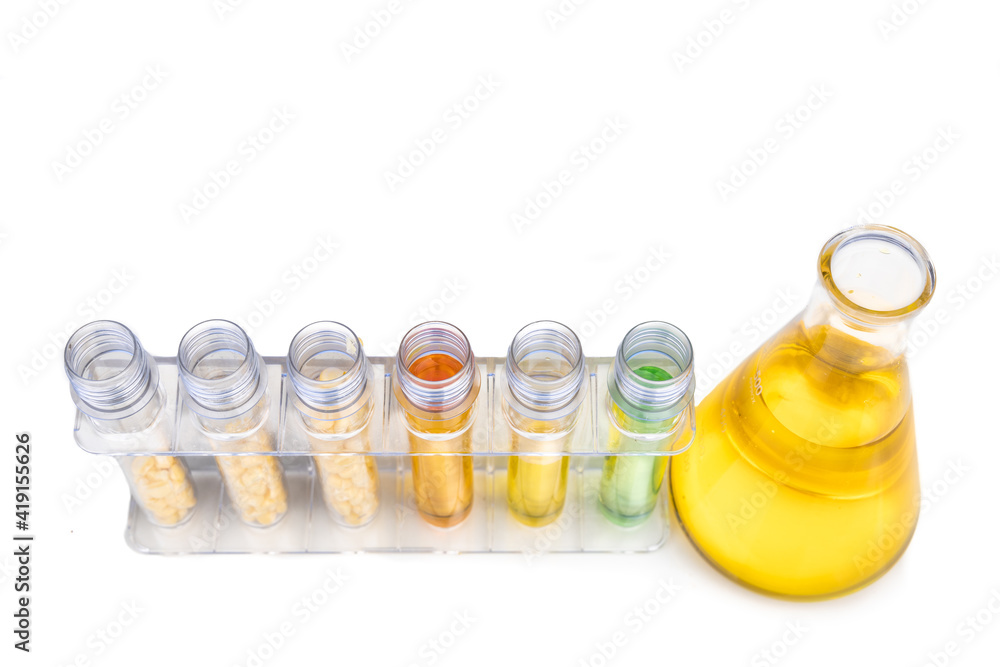 Ethanol biofuel derived from corn maze with beaker test tubes and corn in laboratory Ethanol biofuel derived from corn maze with beaker test tubes and corn in laboratory