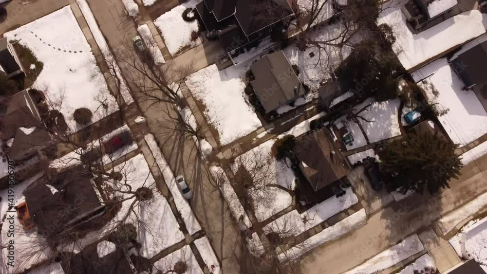 Aerial video drone flying over neighborhood covered in snow storm aftermath Aerial video drone flying over neighborhood covered in snow storm aftermath