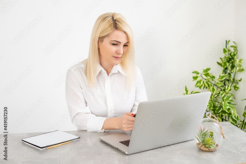 woman laptop online against white wall background woman laptop online against white wall background