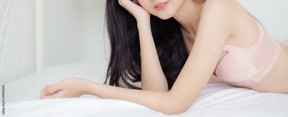 Obraz premium Beautiful young asian woman sexy in underwear figure fit relax in bedroom, asia girl body slim in lingerie confident and happy lying on bed in bedchamber, lifestyle concept, banner website..