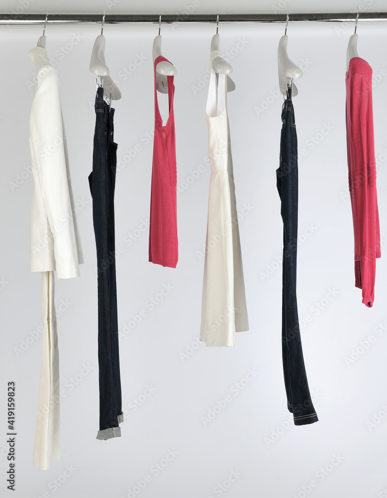 Elegant and trendy women's clothes hanging Elegant and trendy women's clothes hanging