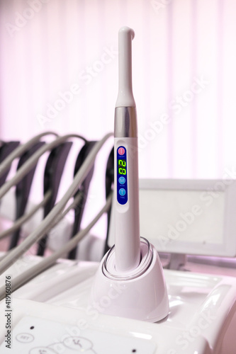 Ultraviolet caries detector on a stand, modern dental equipment. photo