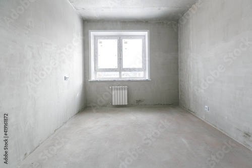 interior of the apartment without decoration in gray colors. rough finish