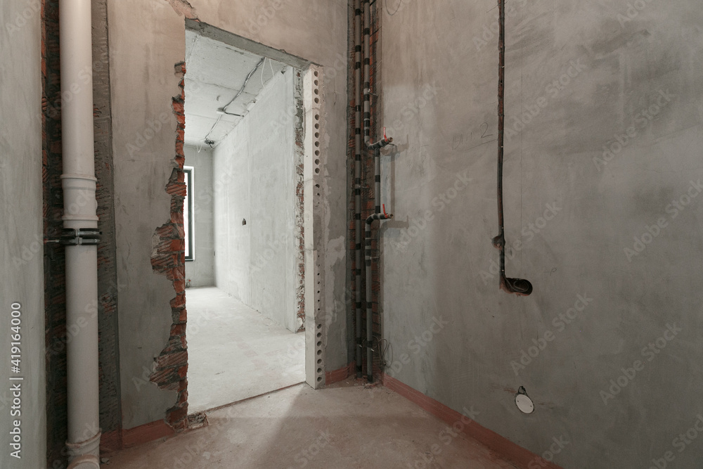 interior of the apartment without decoration in gray colors. rough finish interior of the apartment without decoration in gray colors. rough finish