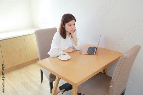 asian wife, woman check the laptop and feel worry  © LT