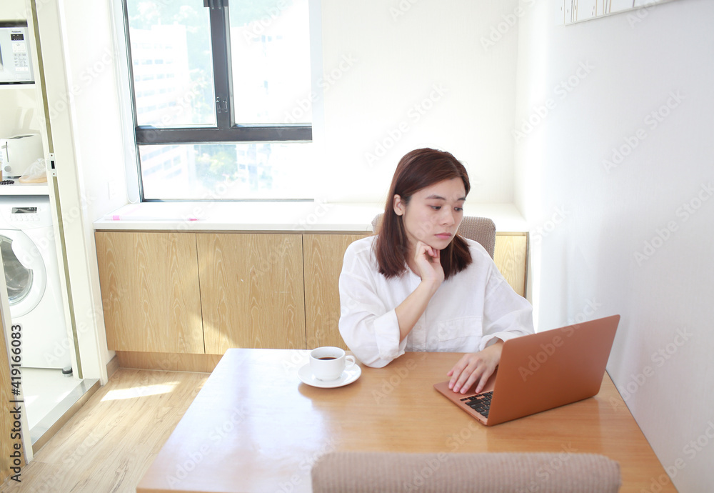 asian wife, woman check the laptop and feel worry 