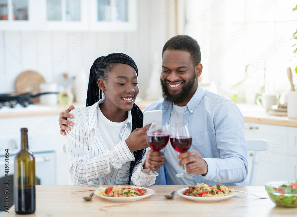 Young Black Lovers Taking Photos On Smartphone While Having Date At Home Young Black Lovers Taking Photos On Smartphone While Having Date At Home