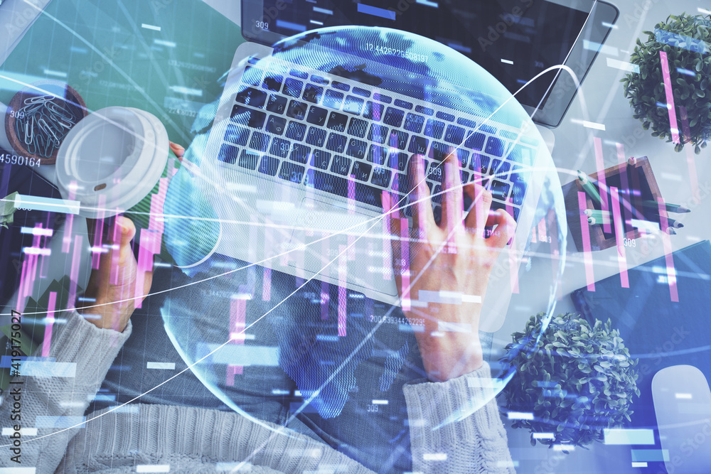 Double exposure of woman hands working on computer and forex chart hologram drawing. Top View. Financial analysis concept.