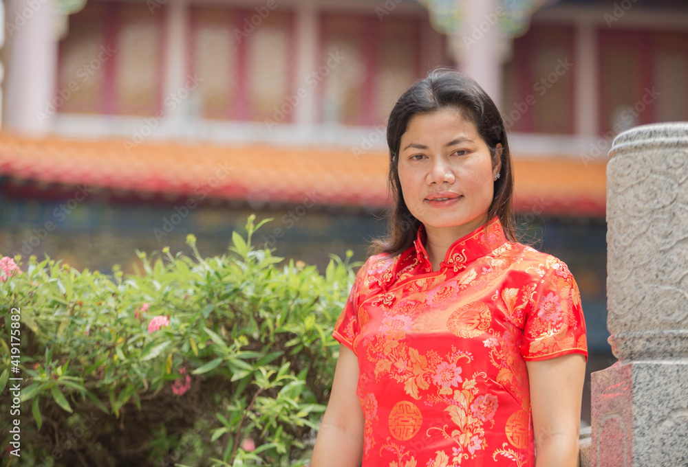 Woman in a cheongsam. Woman in a cheongsam.