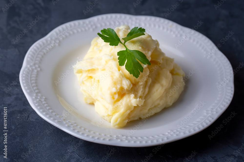 Serving of creamy mashed potato made from boiled potatoes Serving of creamy mashed potato made from boiled potatoes