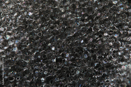 Background texture of black airtight foam rubber