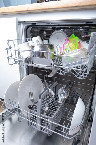 Dishwasher loaded with dirty dishes 
