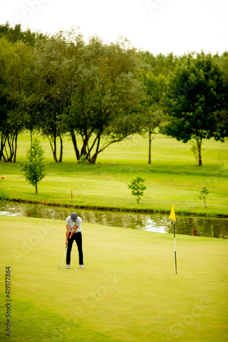 Young man playing golf