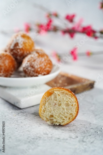 Chinese deep fried round Sugar Dnuts or Doughnuts on white background, selective focus