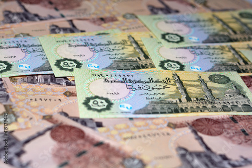 Egyptian banknotes collection background , Egypt Currency of one pound 1 LE paper and 50 piasters banknote , selective focus photo