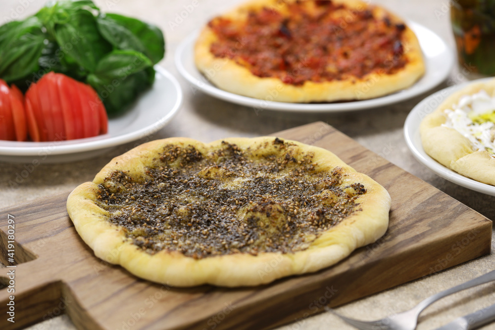 manakeesh, lebantine pizza, topping with zaatar(thyme), labneh(strained