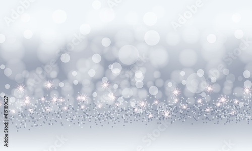 silver bokeh background with snowflakes