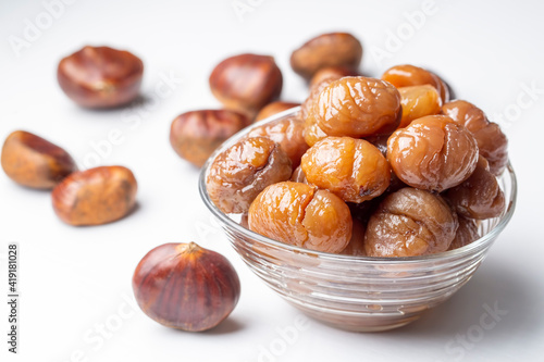 Chestnut dessert and chestnuts on a plate. Traditional delicious Turkish dessert; chestnut candies (Kestane Sekeri) photo