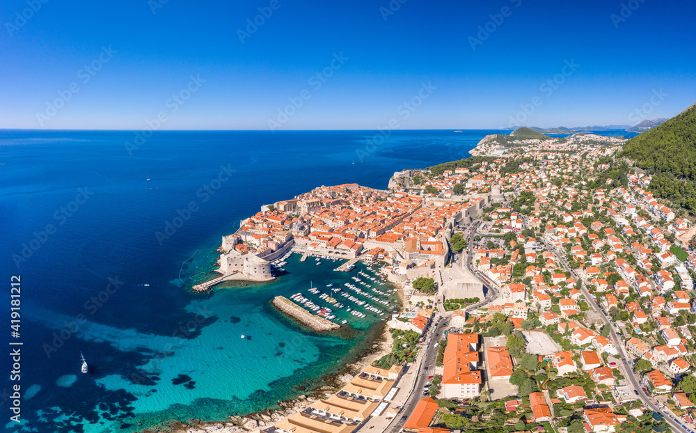 Aerial drone shot of Old Port in east Dubrovnik old town in Croatia summer morning