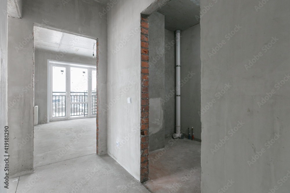 interior of the apartment without decoration in gray colors. rough finish