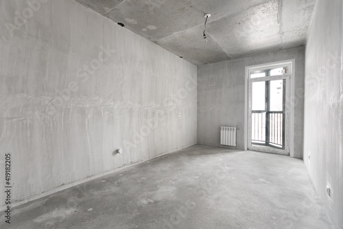 interior of the apartment without decoration in gray colors. rough finish