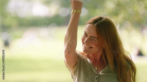[4k] happy dance of beautiful young successful woman cheering