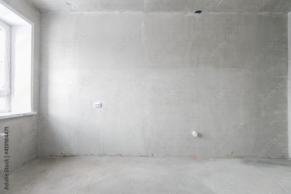 interior of the apartment without decoration in gray colors. rough finish interior of the apartment without decoration in gray colors. rough finish