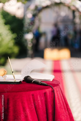 microphone on a red table close-up Banquet at the wedding